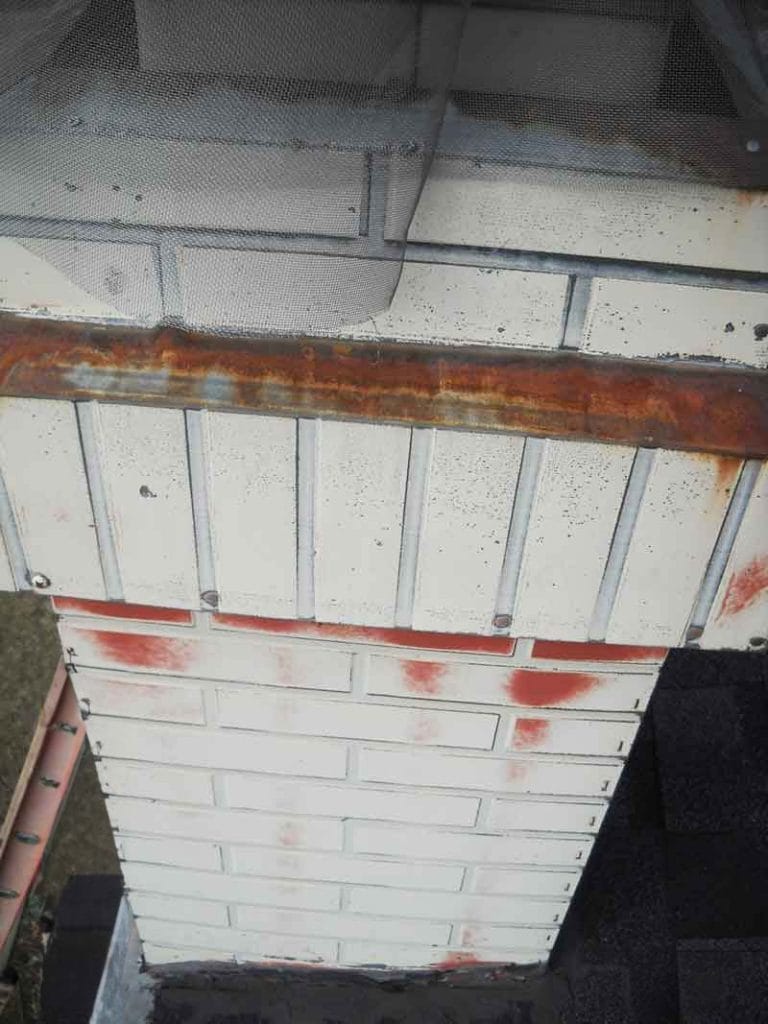 Old Metal Chimney with Painted Brick